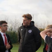 Carl Piergianni chats to students as he opens the new 3G pitch at Marriotts School