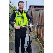 A police officer returns the stolen bicycle to its owner.