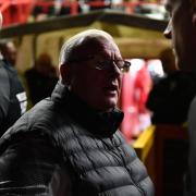 Steve Evans talks to officials as Stevenage's game with Cambridge United was postponed. Picture: TGS PHOTO