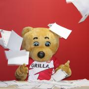 Boro Bear judging the Book Club entries for last year's competition.