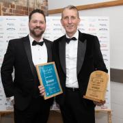 Dr Andy Wood OBE, CEO of Adnams, was presented with the Outstanding Contribution to Tourism Award at this year's East of England Tourism Awards. Pictured is Dr Wood (right) with Craig Loxston from award sponsor Hoseasons