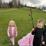 Two young volunteers after a successful morning of litter-picking on Windmill Hill