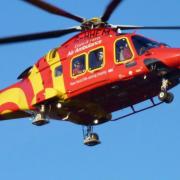 Essex & Herts Air Ambulance were called to the scene after a woman in her 60s reportedly fell from a moving vehicle.
