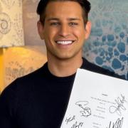 Ollie Locke with his signed original Friends script.
