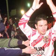 Stevenge's Giuliano Grazioli celebrates with fans after the draw with Newcastle in 1998. Picture: ADAM BUTLER/PA