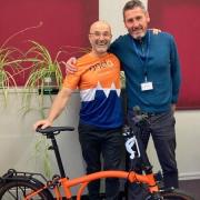 Phil Adams (left) plans to cycle 1,300 miles after the wife of his friend Rob King was diagnosed with motor neurone disease.