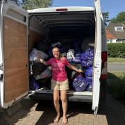 Amanda Dickinson with the bags of clothes donated by members of the Letchworth Slimming World members.