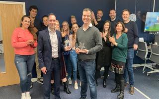 Adam Cleevely (centre right) and the FutureYou Cambridge team receiving their Best Employers Eastern Region award from Mark Wishart of Pure