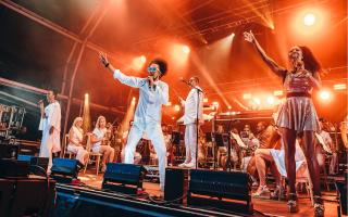 Vocalists on stage with the Urban Soul Orchestra at Classic Ibiza 2022 at Hatfield House.