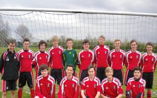 Andy (far left) with one of the two teams when they were at school