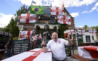 Landlord Norman Scott outside the Robin Hood pub in Jarrow ahead of the 2014 World Cup. Picture: OWEN HUMPHREYS/PA