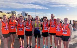 Katie Harbon (right) and Stuart Overton (fourth from left) of North Herts Road Runners were in the Herts 10k squad at Brighton. Picture: NHRR