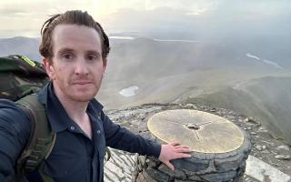 Greg Wilson at the summit of Snowdon during his record-breaking challenge.